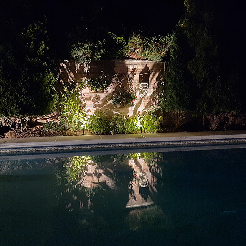 Wall with decorations and hardscape lighting