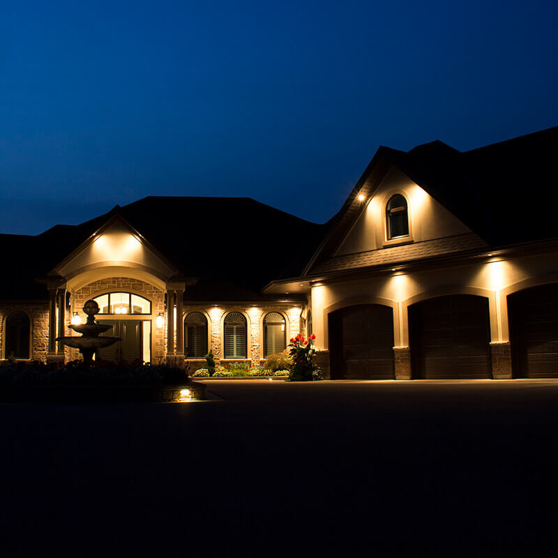 A front of a house illuminated